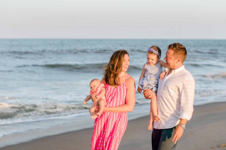 Family beach photography captures joyful moments with sunlit outdoor portraits by the ocean.